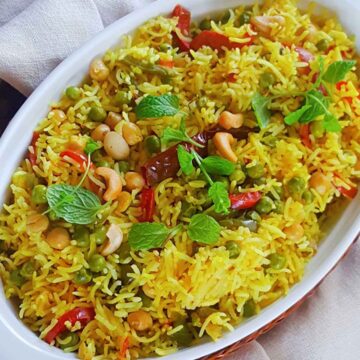 spicy vegetable rice served in a white dish