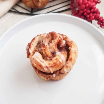 Cinnamon roll muffin served in a white plate