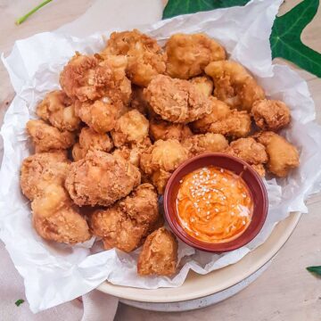 vegan Fried cauliflower served in a plate with dip on side