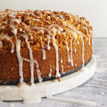 side view of coffee cake with sugar glaze drippings