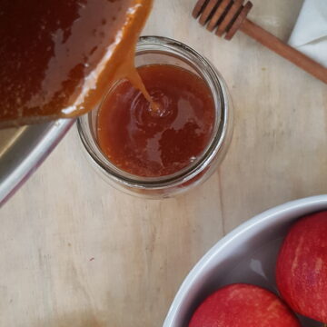 pouring vegan honey in jar