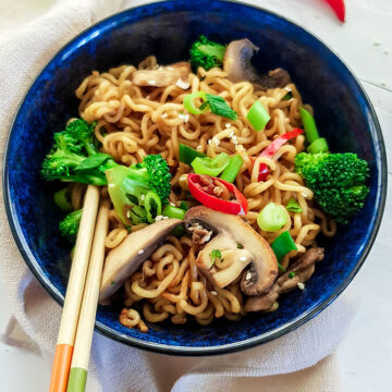 Ramen stir fry in a bowl with chopsticks
