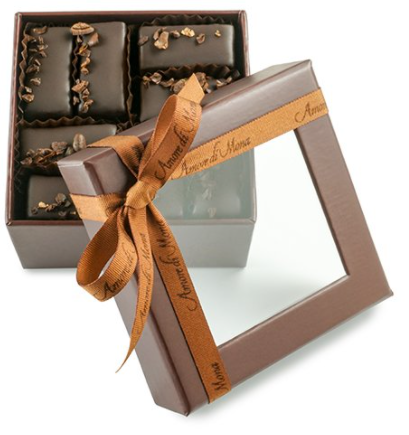 brown color transparent lid chocolate box and ribbon.