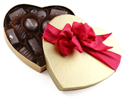 golden heart shape chocolate box with red ribbon 