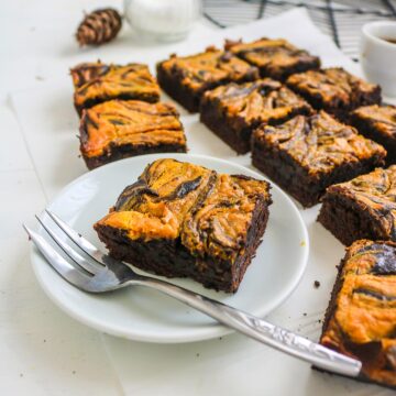 vegan pumpkin brownies served with white plate and fork