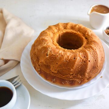 Vegan Pumpkin Bundt cake on a plate served with black coffee