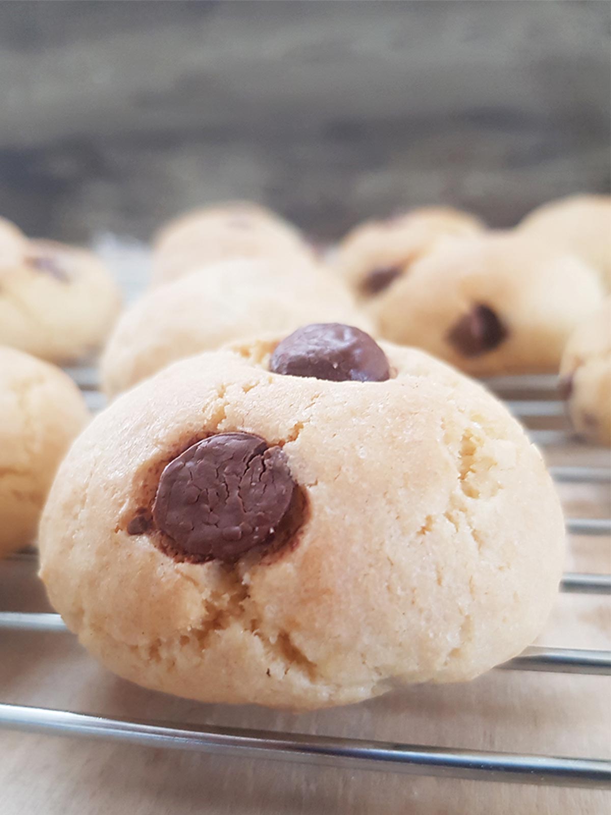 Eggless chocolate chip cookies on a wire rack