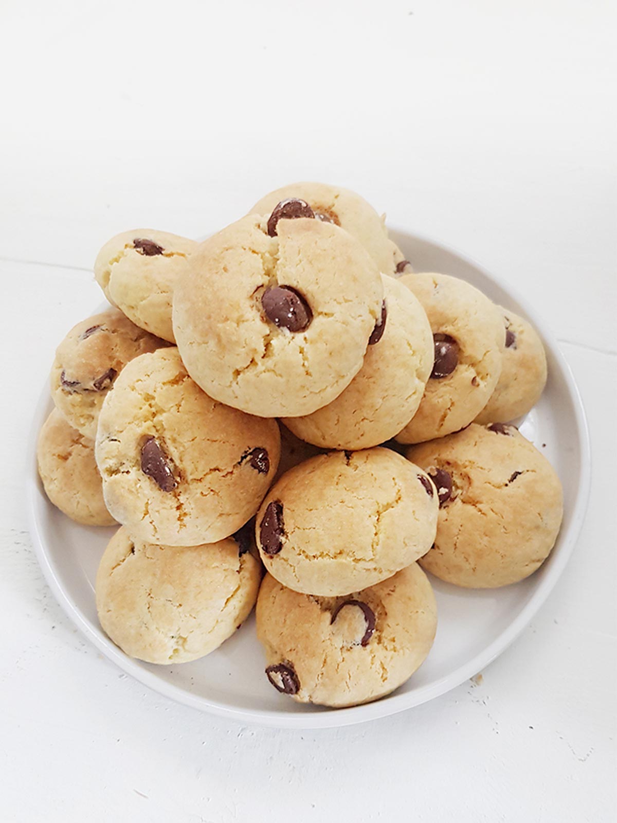 Eggless chocolate chip cookies pile on  a plate