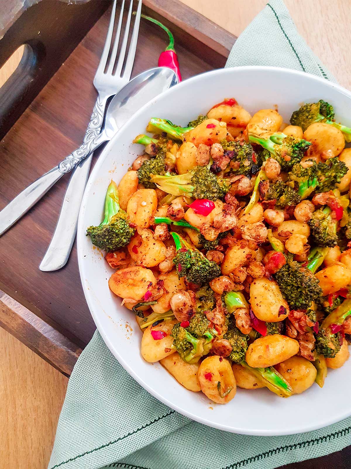 gnocchi served in white bowl with silver fork