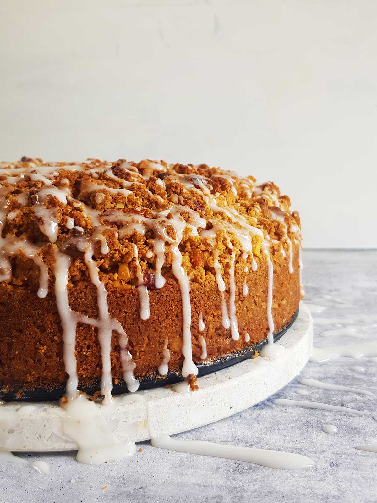 side view of coffee cake with sugar glaze drippings