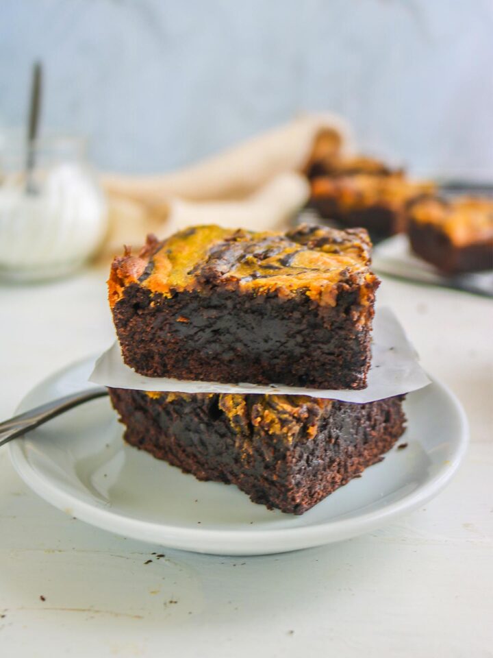 vegan pumpkin brownies served with white plate and fork