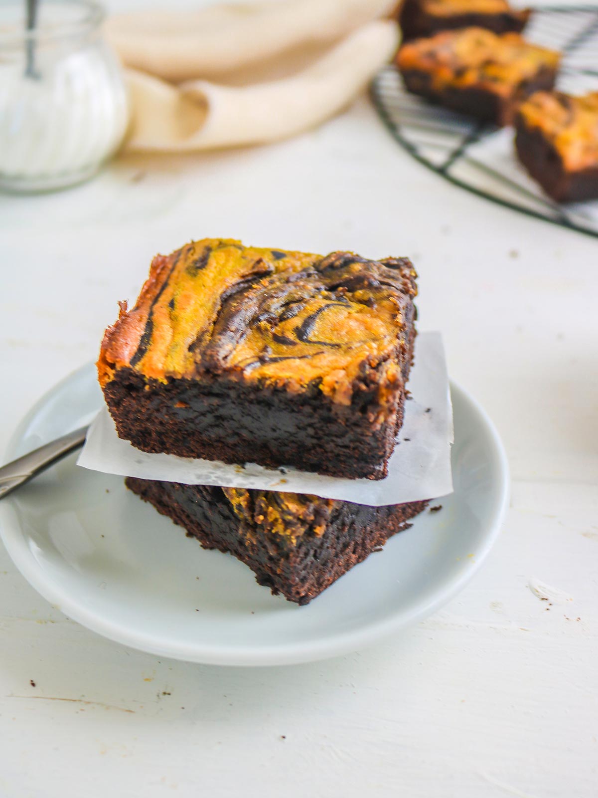 vegan pumpkin brownies placed on one on each other