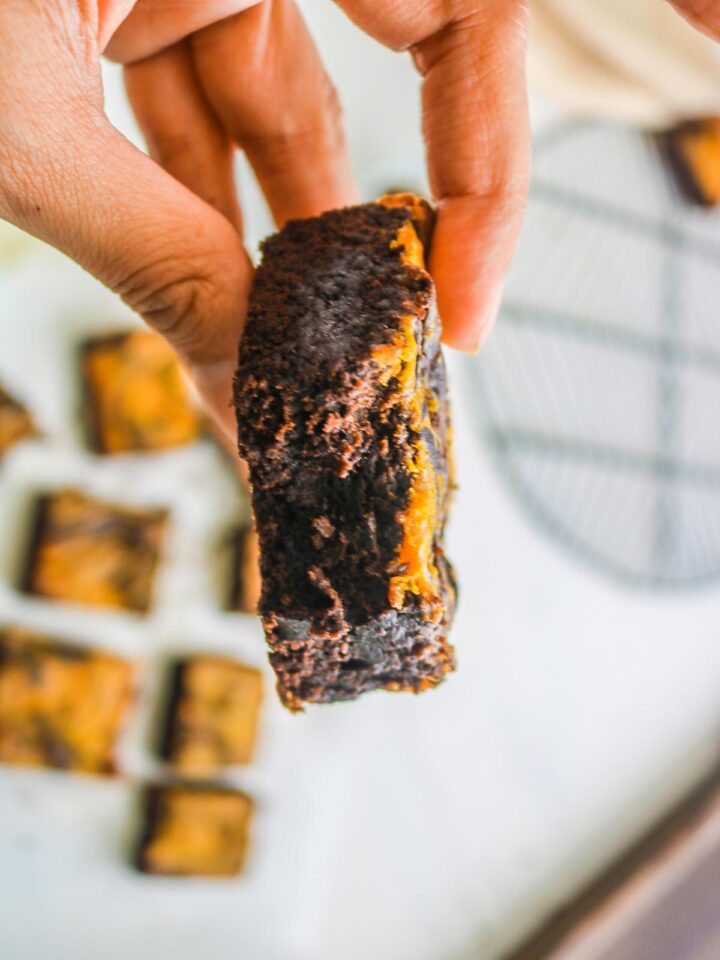 vegan pumpkin brownies in hands