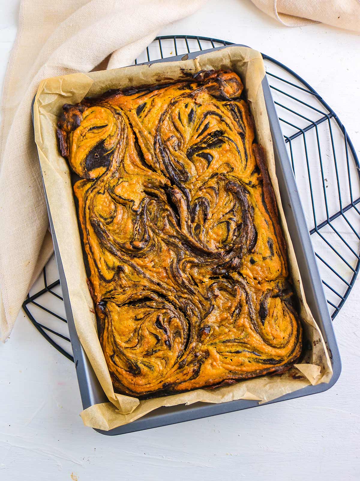 vegan pumpkin brownies out of oven before slicing