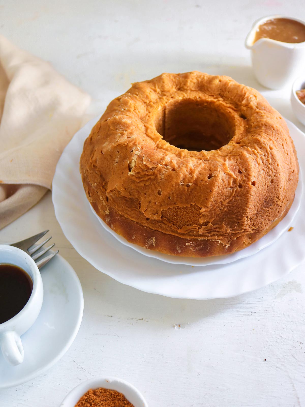 Vegan pumpkin bundt cake served with coffee 