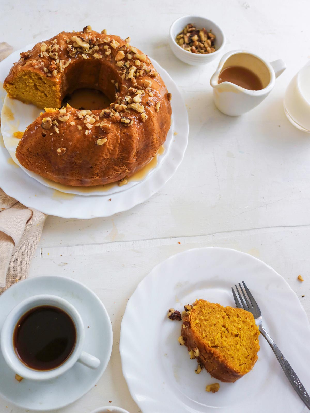 pumpkin bundt cake slice served wuth black coffee 