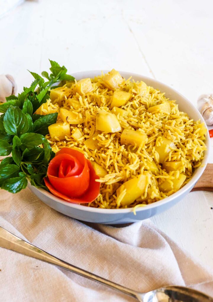 rice served in a abowl with mint leaves