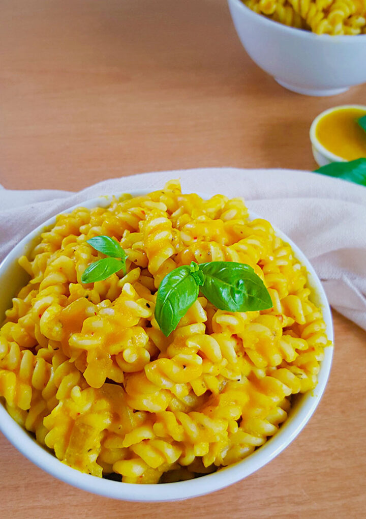 pumpkin pasta garnished with basil leave 