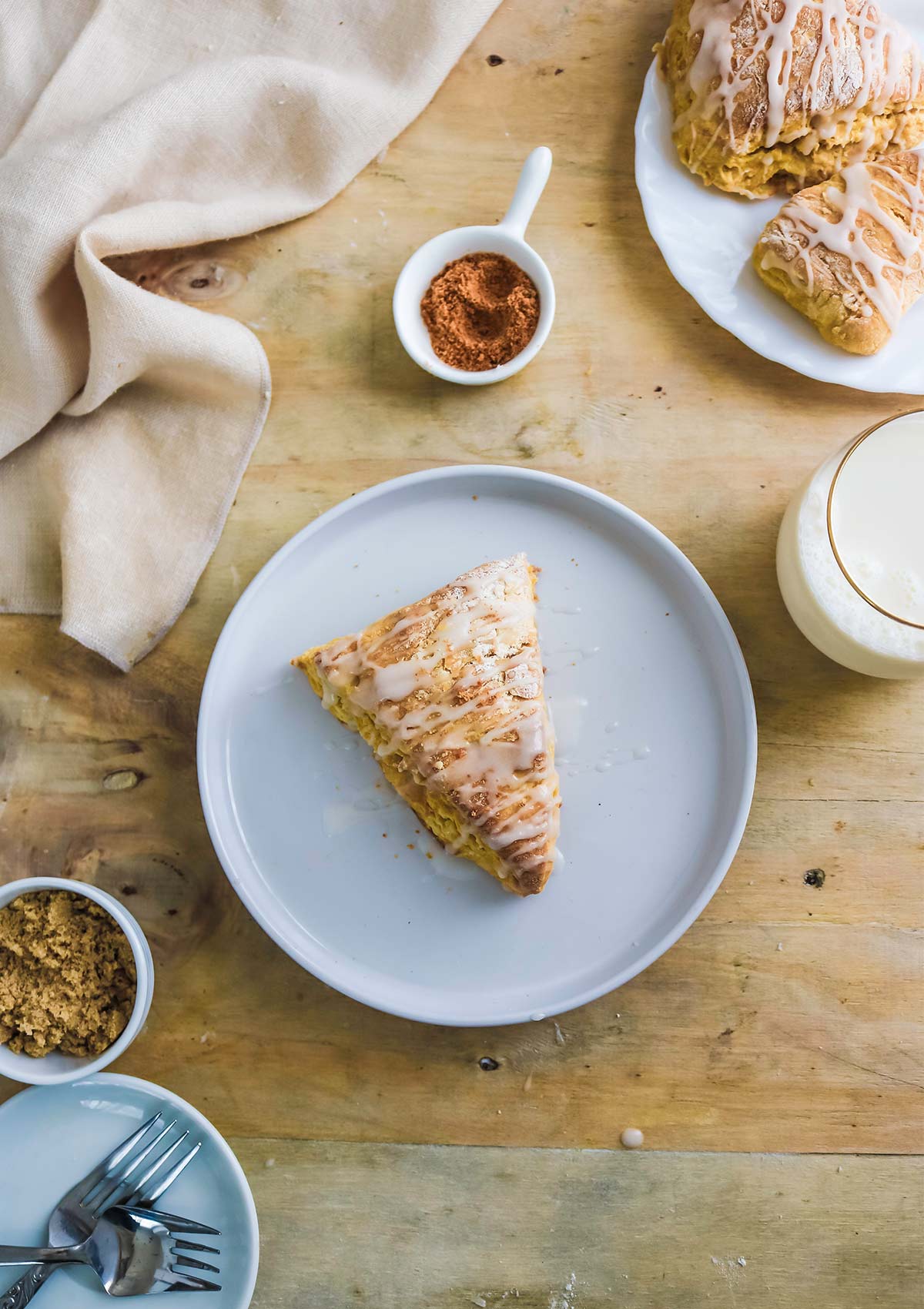 crispy vegan pumpkin scone topped with glaze