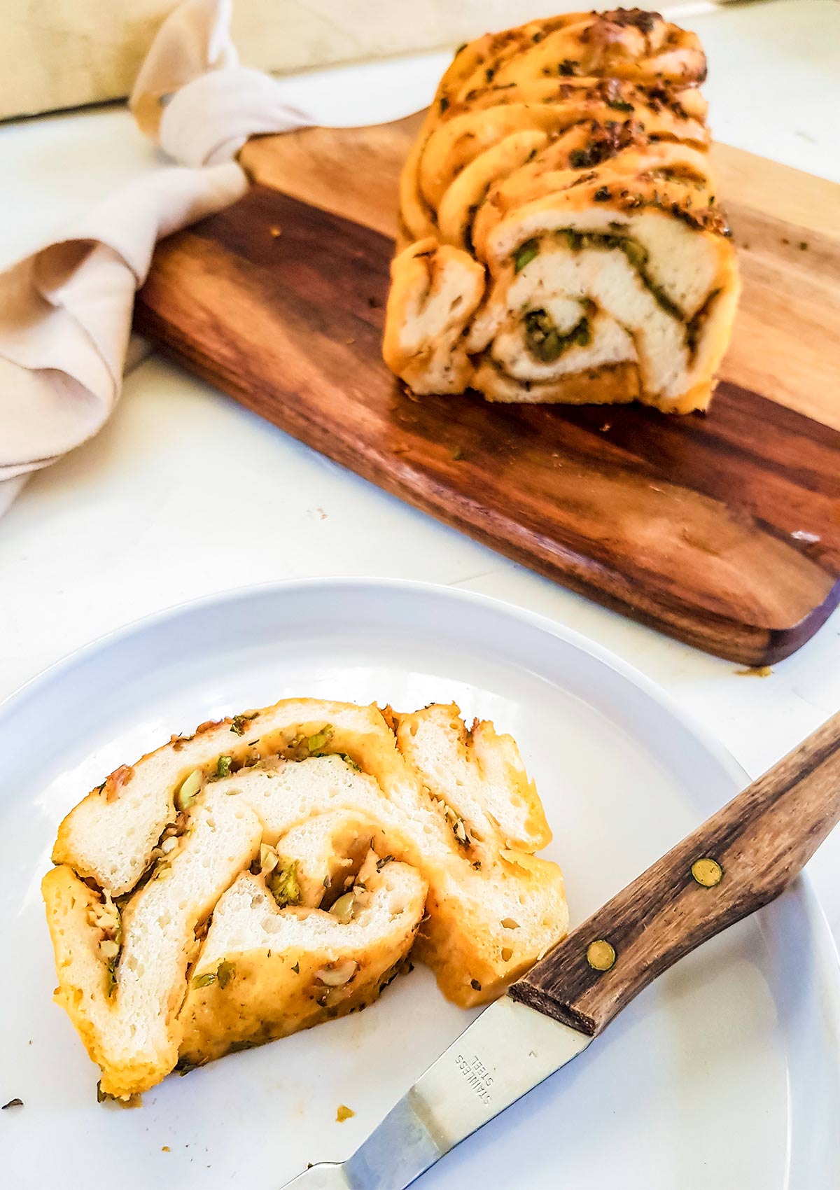 savory babka slice in a plate with fork