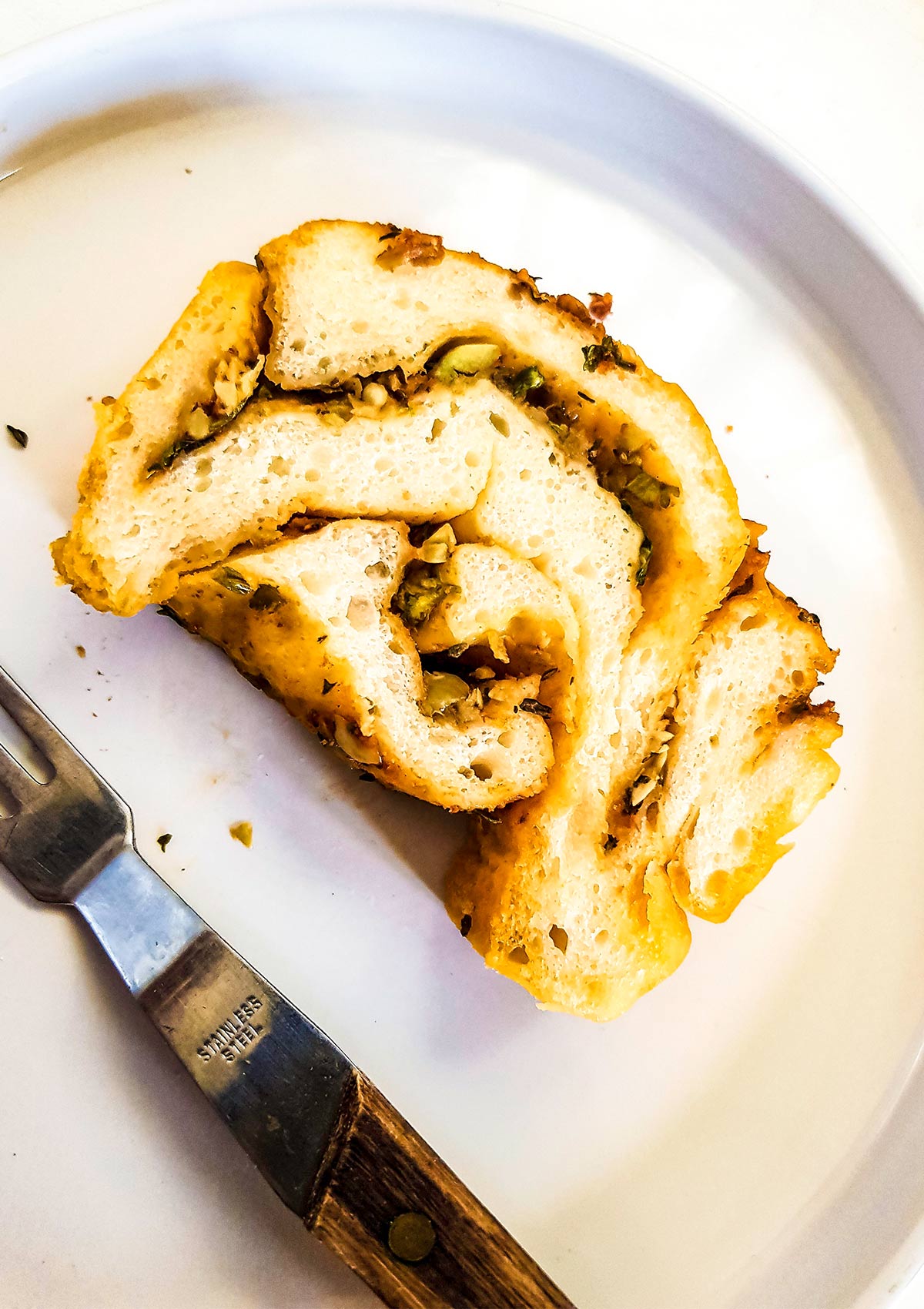 savory babka slice in a plate with fork