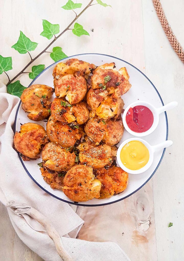 smashed potatoes served with dipping sauces on side