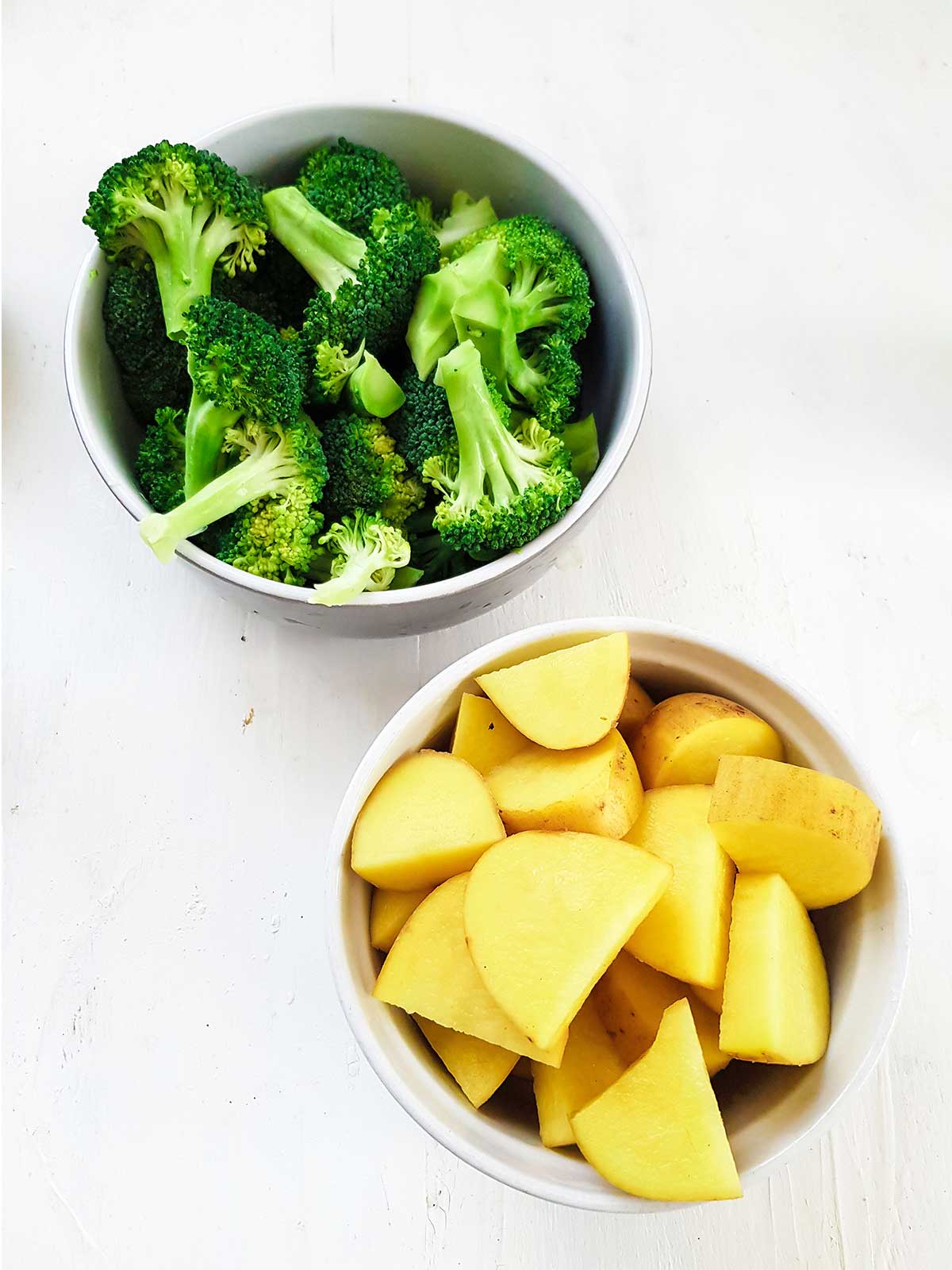 sliced potatoes and broccoli florets