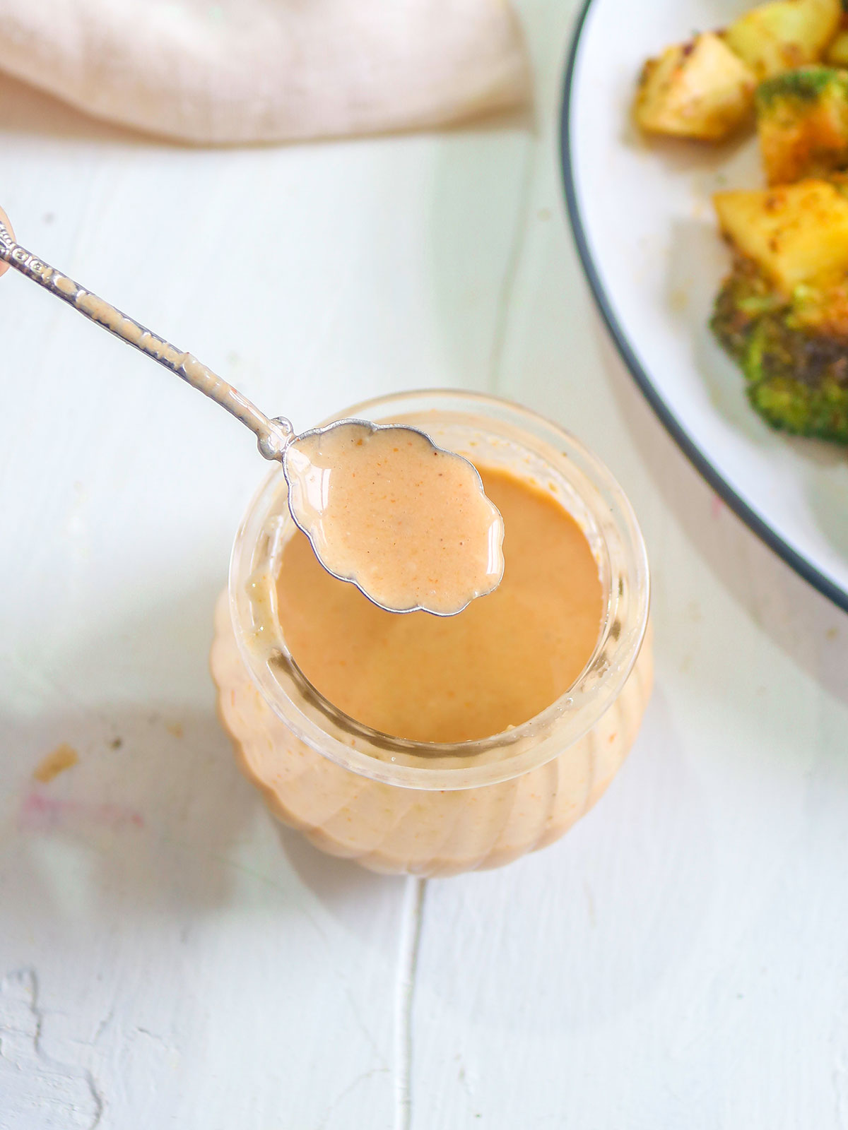 Tahini sauce in a spoon