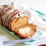 Pumpkin banana bread loaf sliced and placed on a tray.