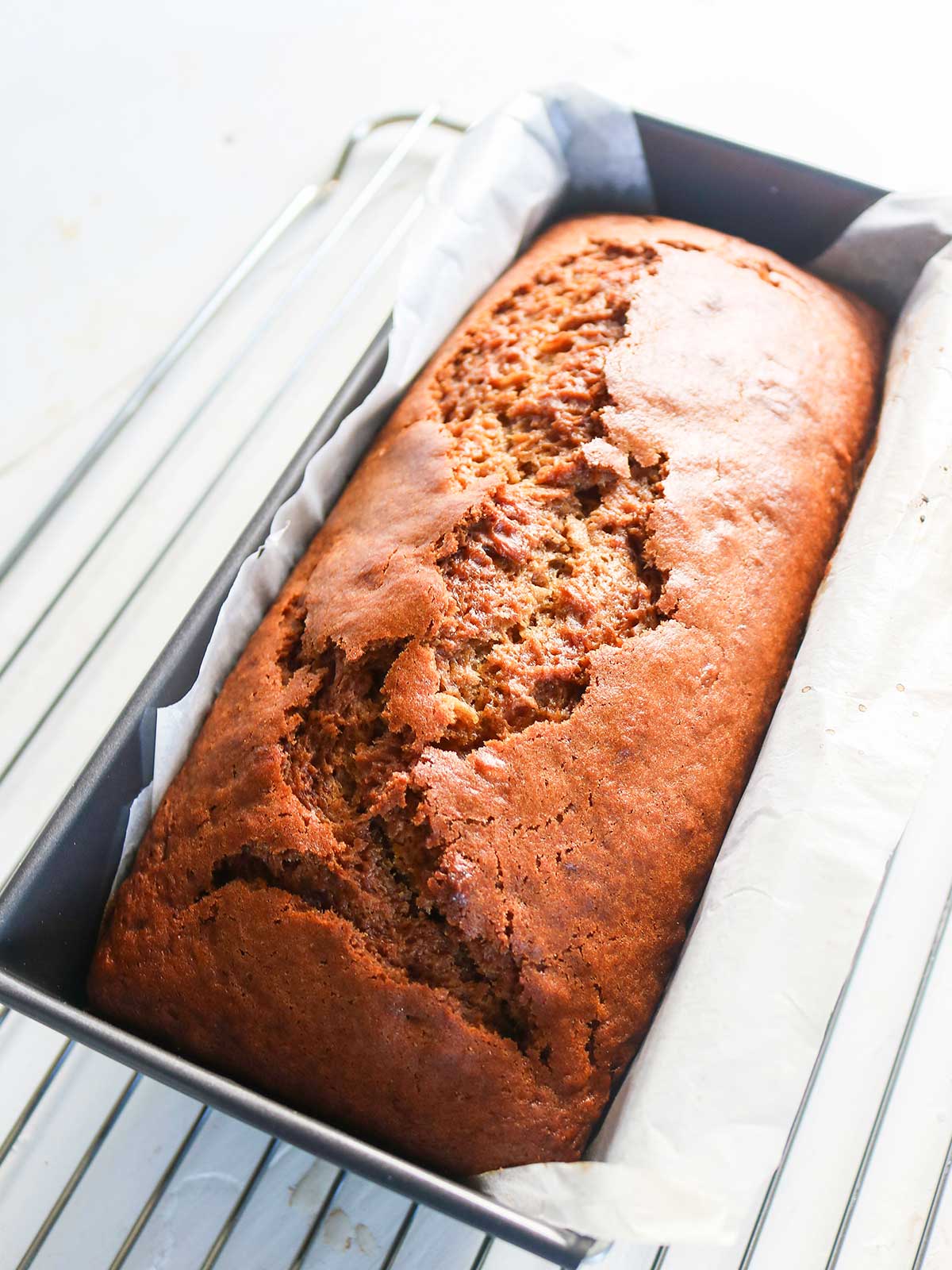 cooling down the baked vegan pumpkin banana bread on wire rack