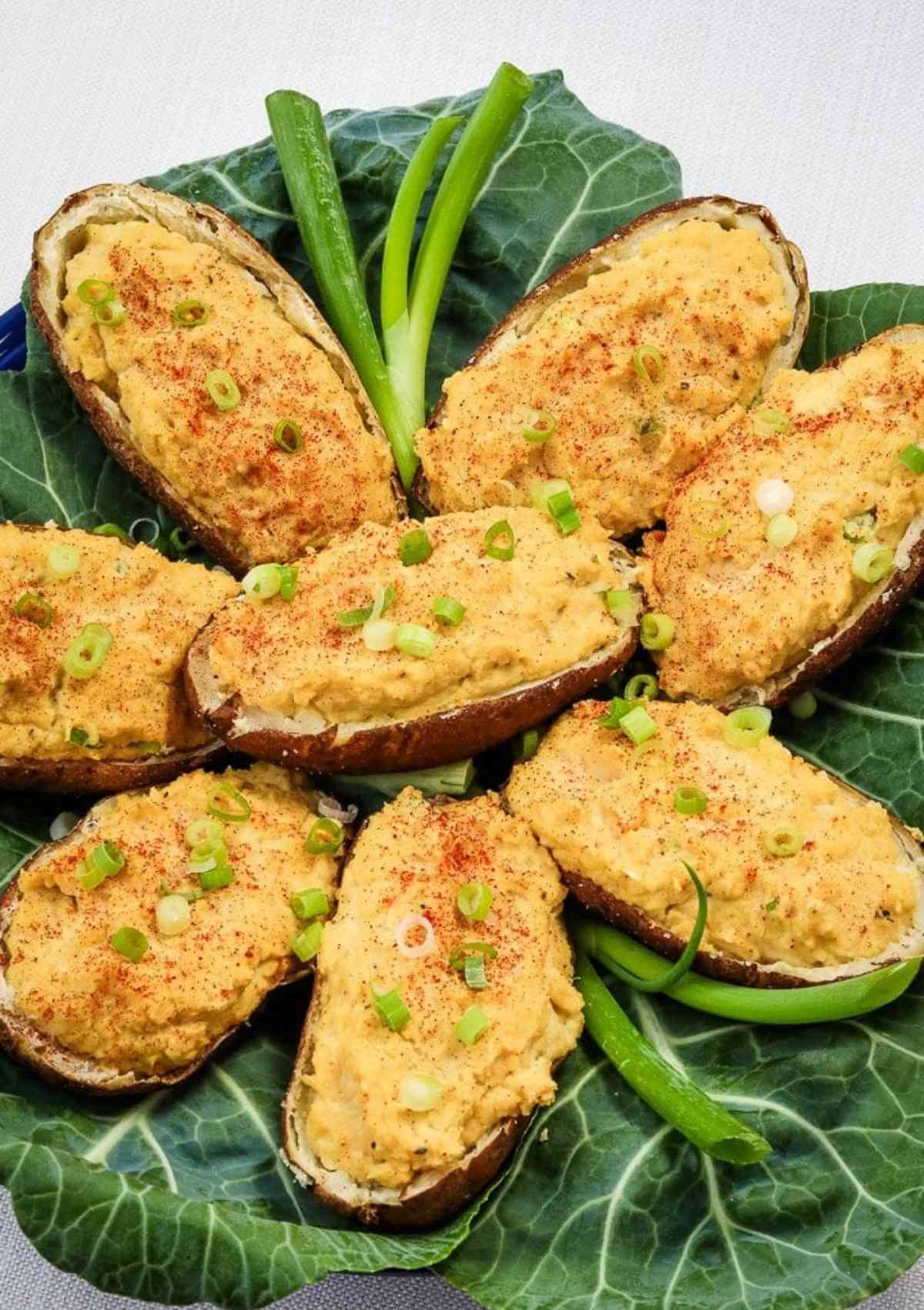 twice baked potatoes served on a green leaf