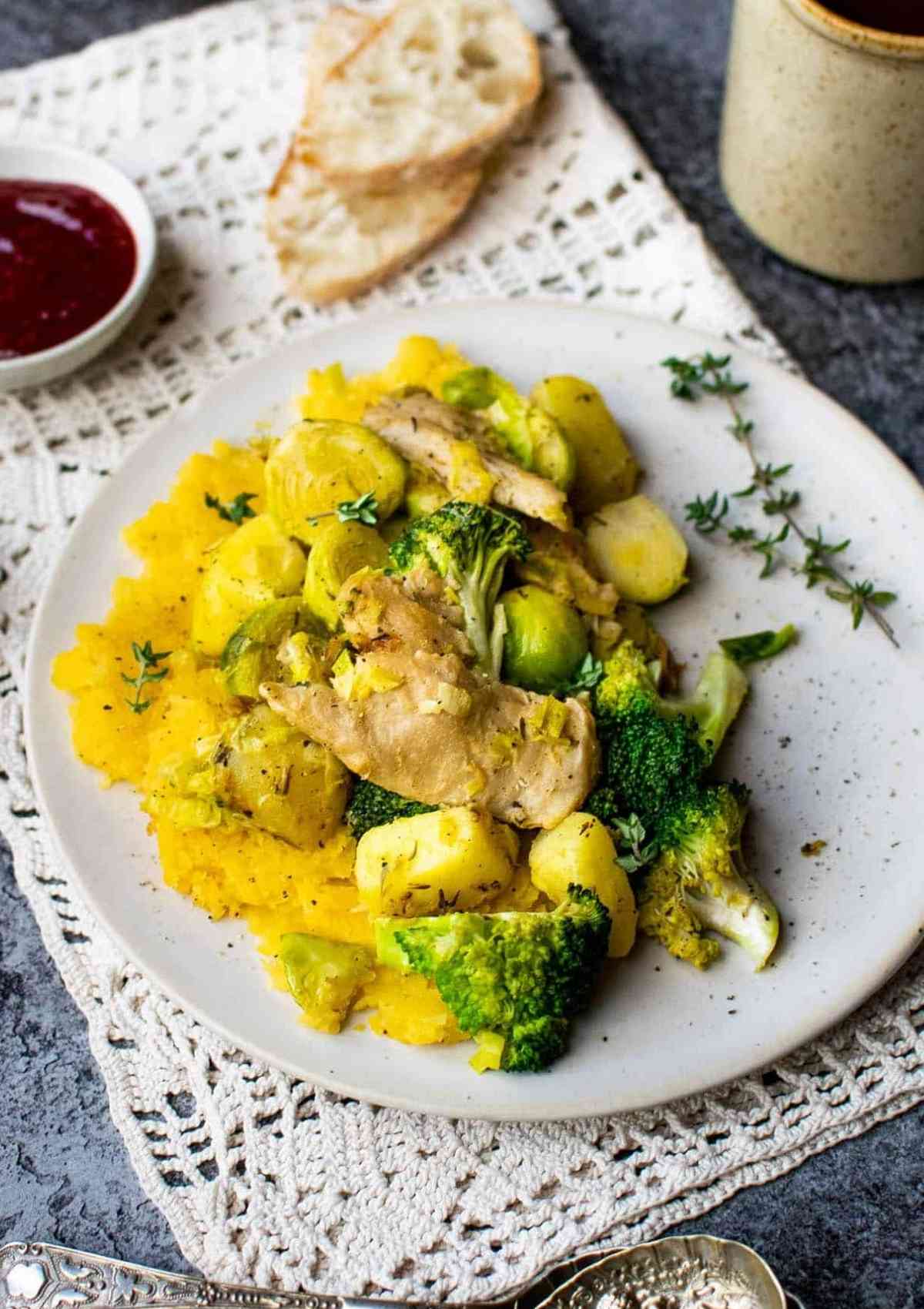 potato hash with vegetables on a white plate