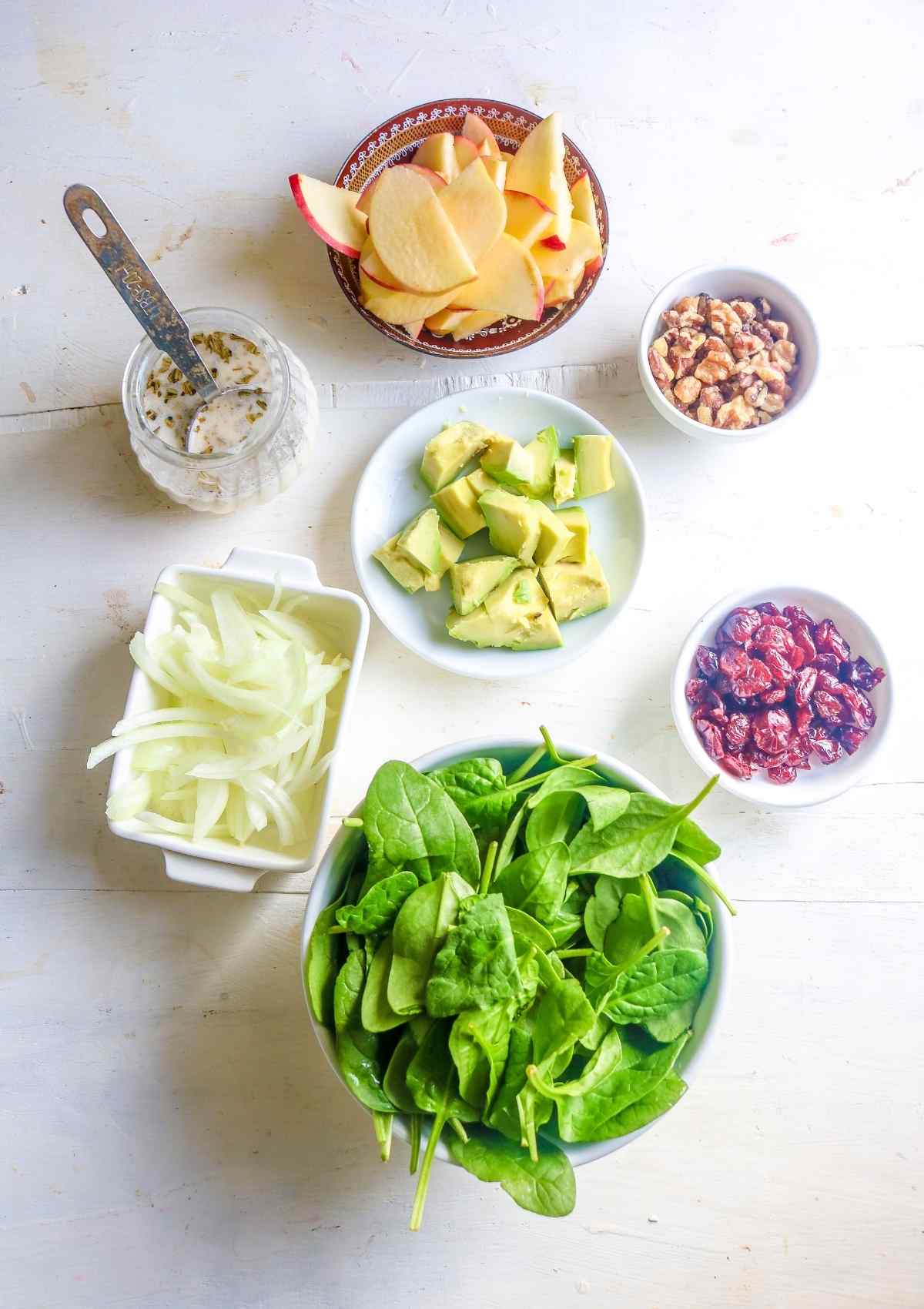 Ingredients to make vegan spinach salad