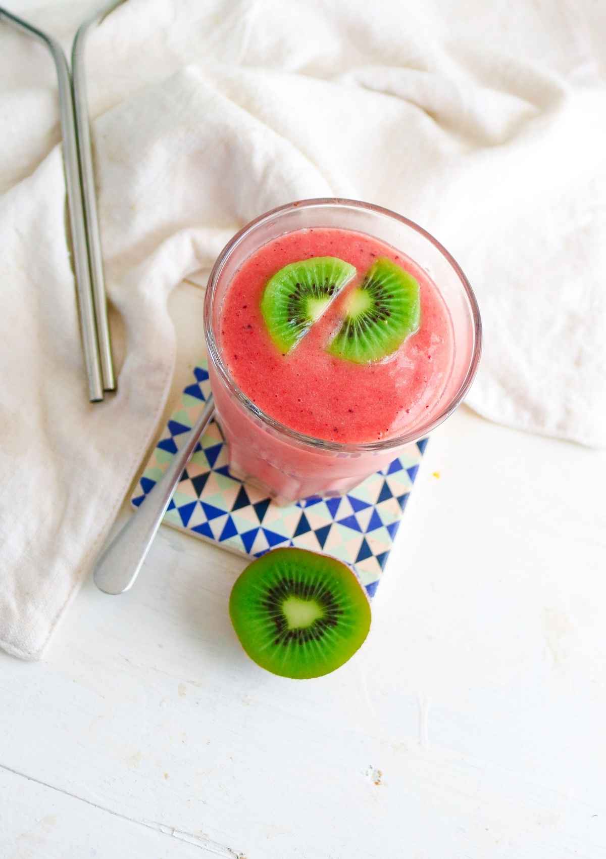 smoothie served in a glass with metal straws