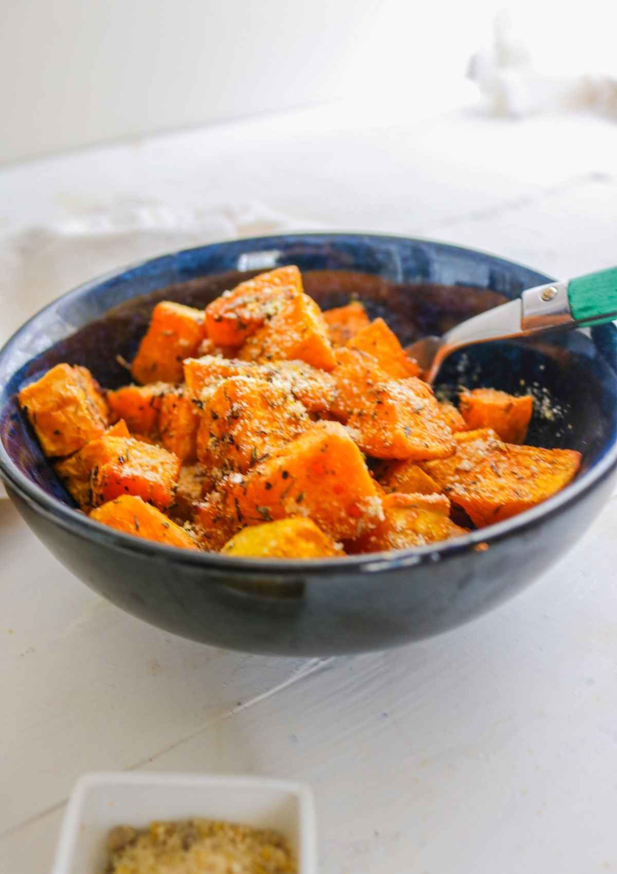 Air fried Butternut squash in a blue bowl.