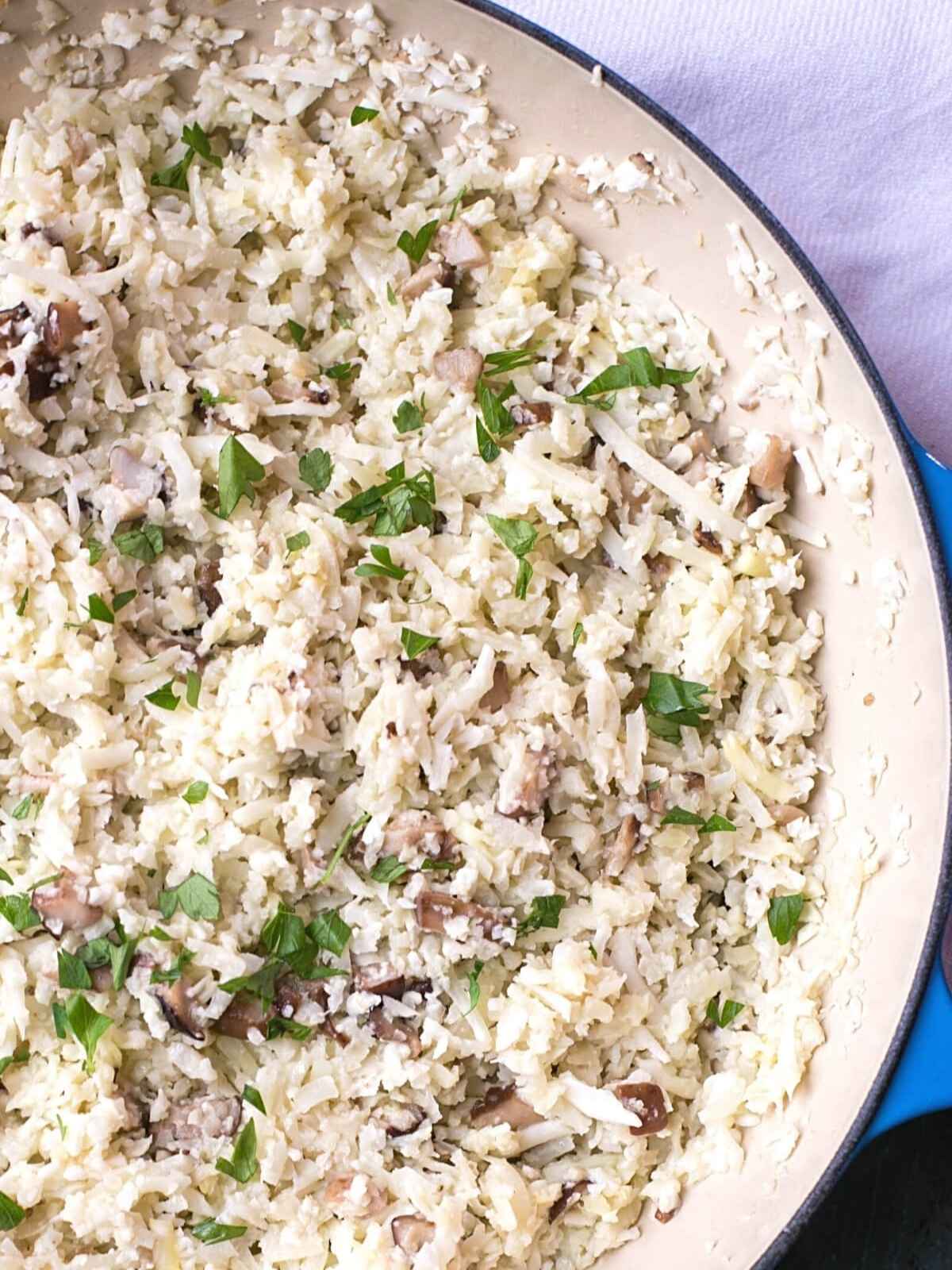 Pan filled with white color cauliflower rice.