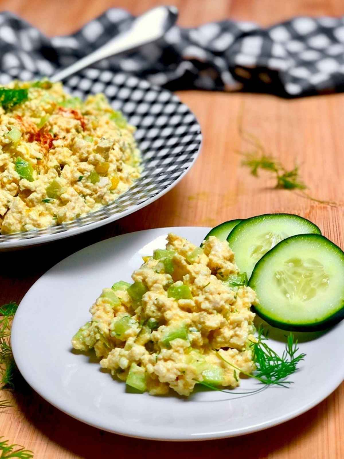 Vegan eggless salad served in a white plate.