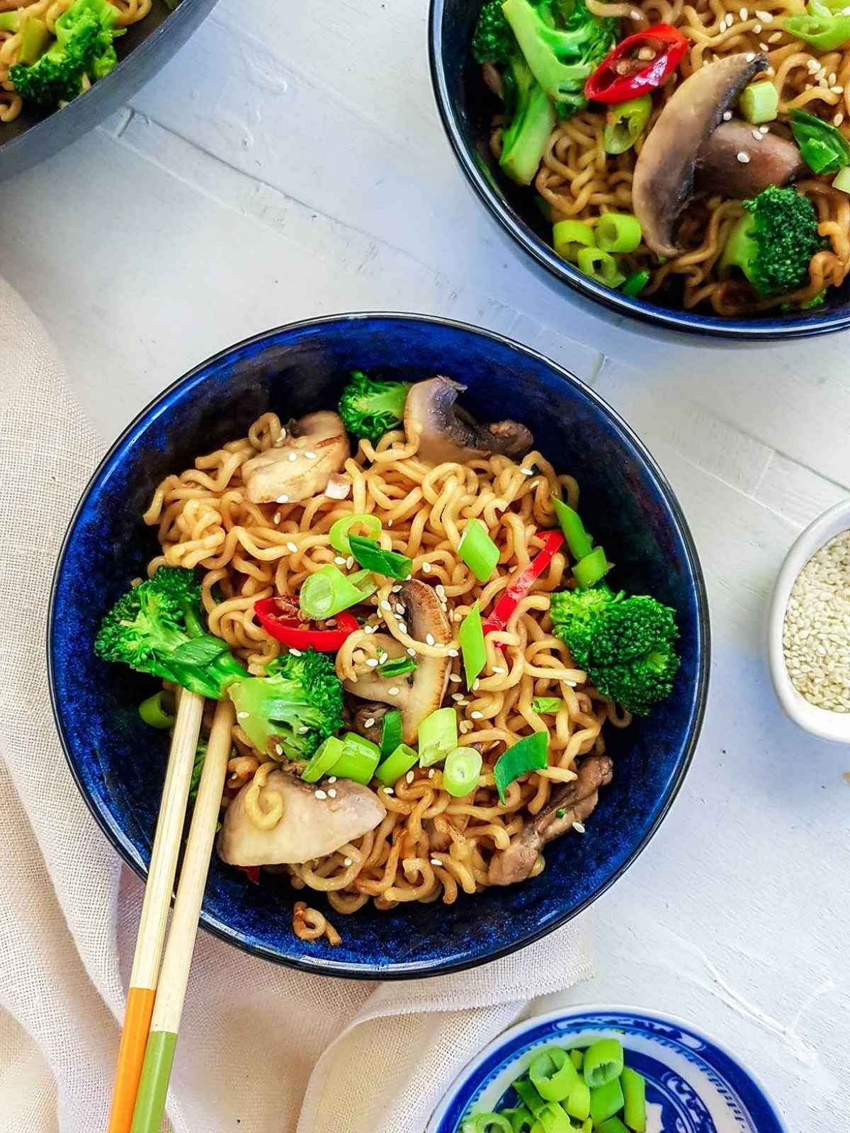 ramen stir fry in a blue bowl