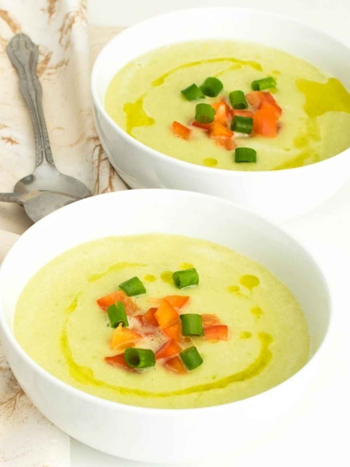 Cold soup served in two white bowls. 