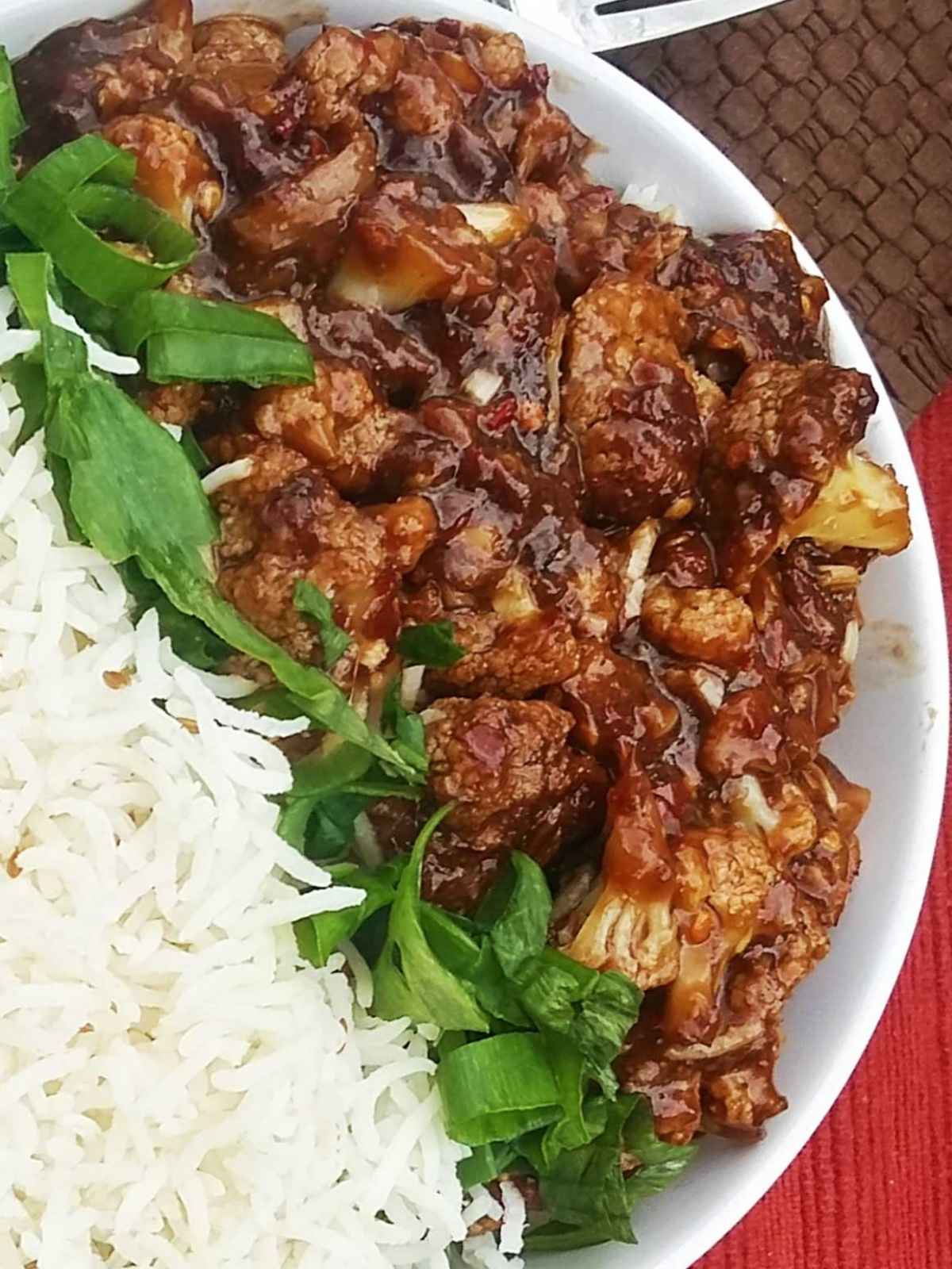 sweet and sour cauliflower in a white bowl