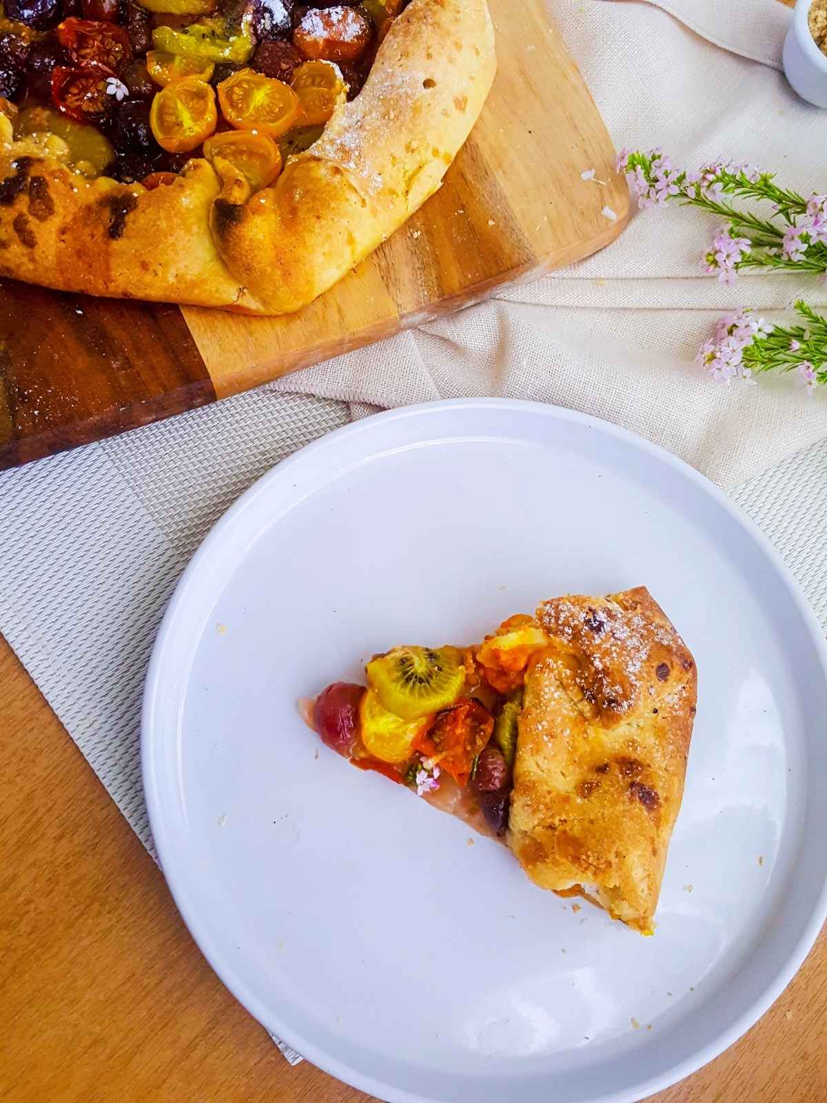 galette slice served on a white plate on an orange background