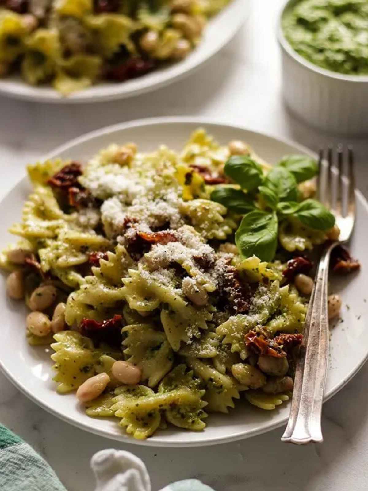 pesto pasta served in a plate. a perfact vegan dinner