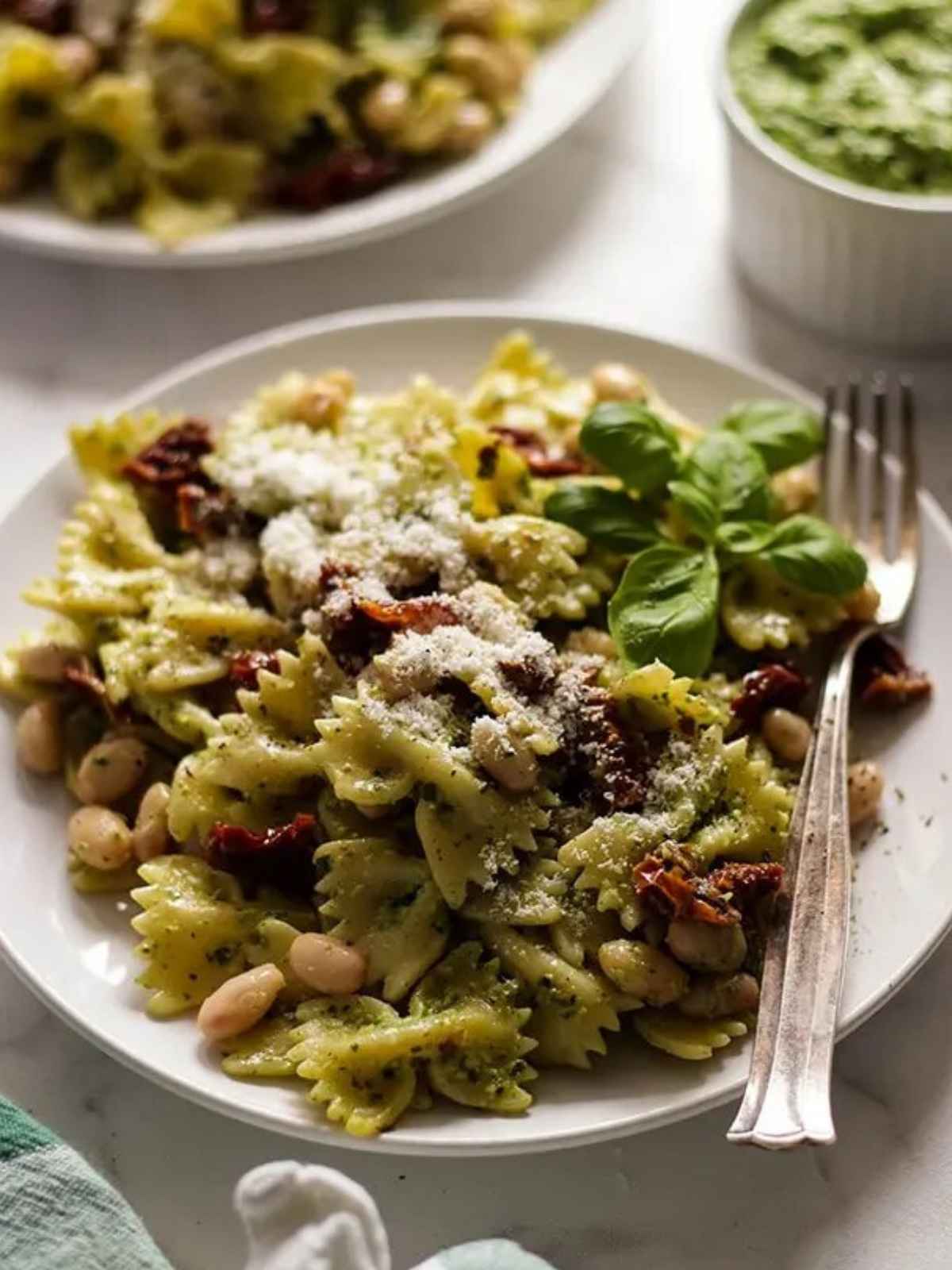 pesto pasta served in a plate. a perfact vegan dinner