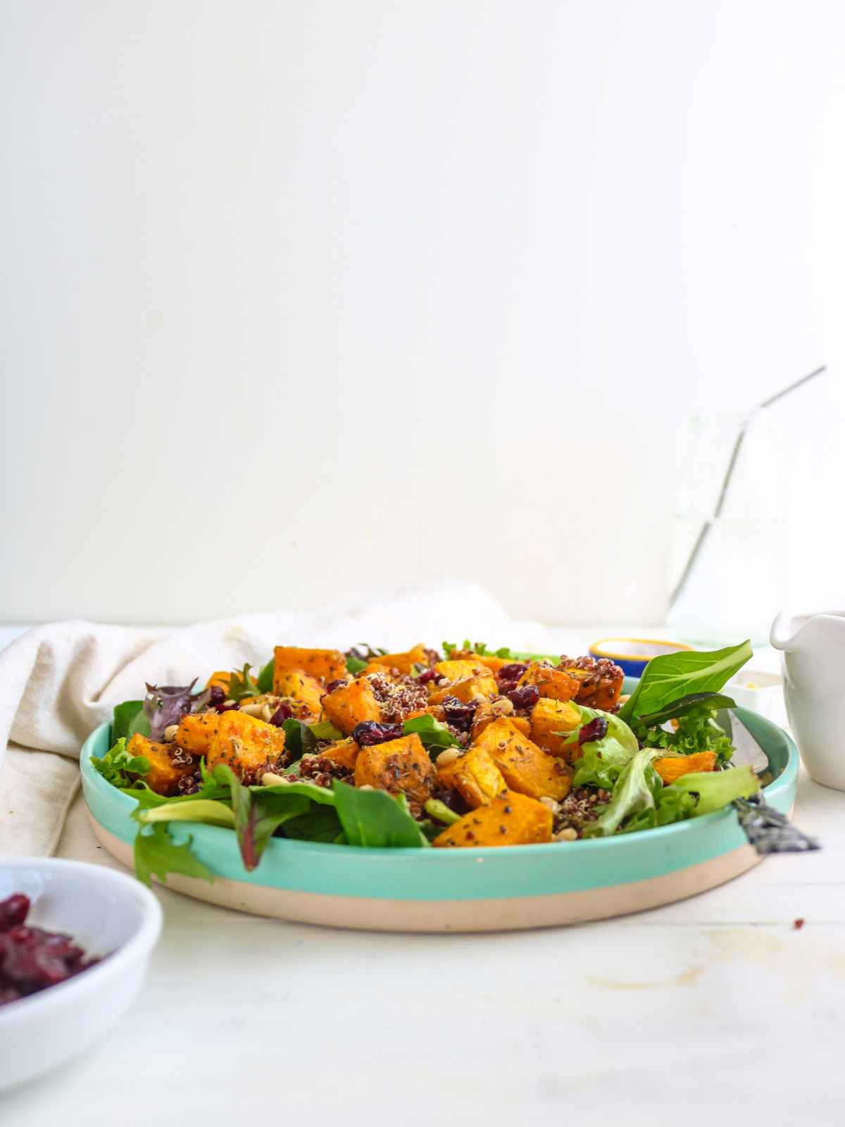 side view of butternut squash quinoa salad served in a plate.