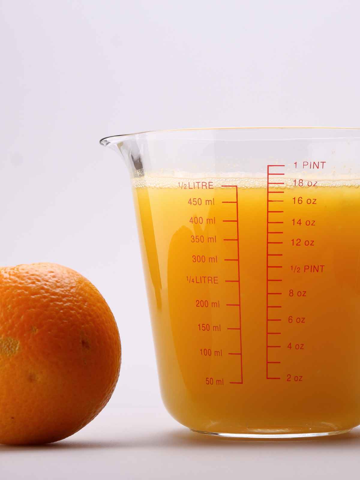 Measuring Glass jar for Liter filled with juice.