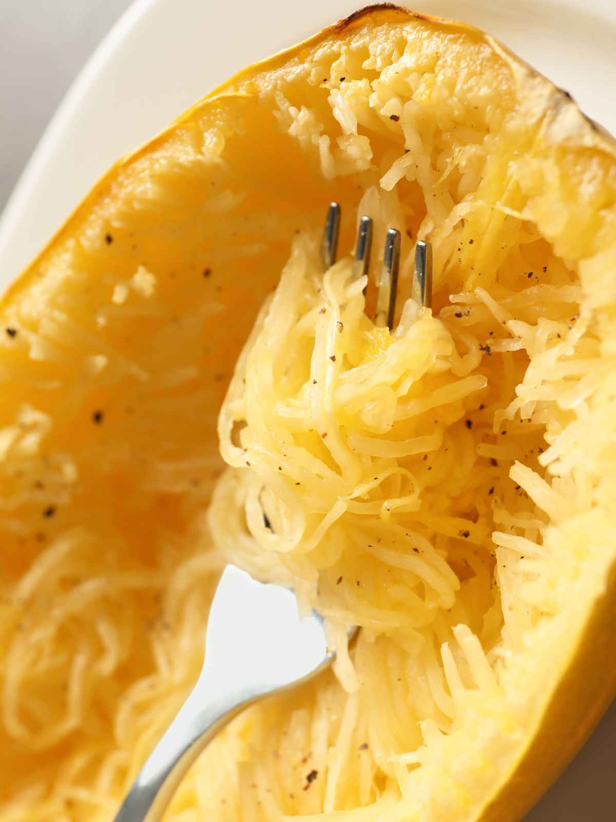 Baked spaghetti squash with a silver fork.