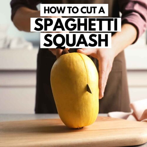 Cutting a spaghetti squash with chef knife.