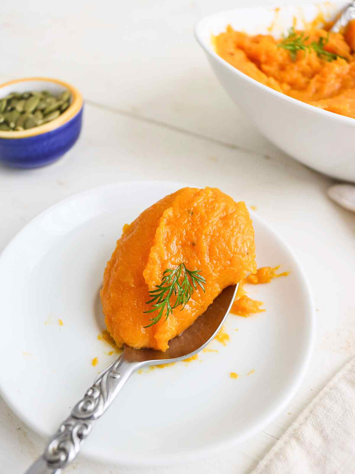 squash mash in a spoon.