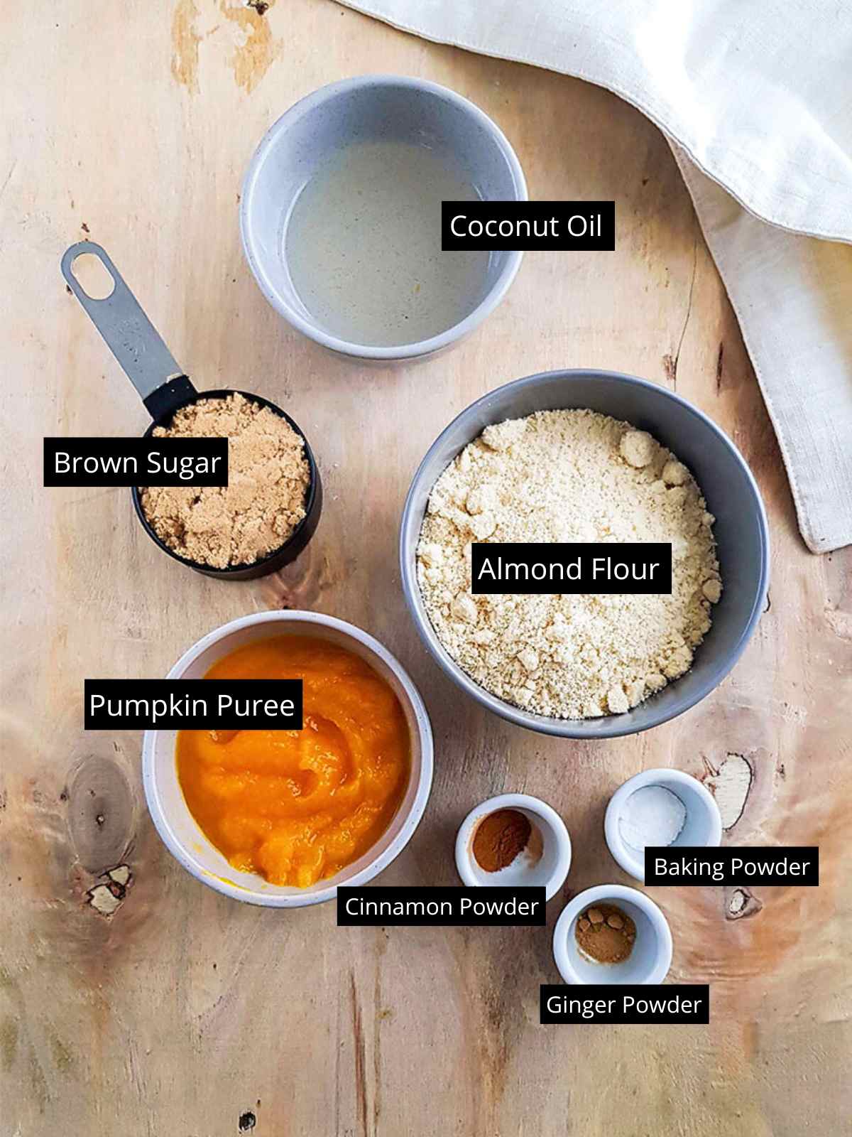 Pumpkin Almond Flour Cookies ingredients placed in separate bowls and tagged.