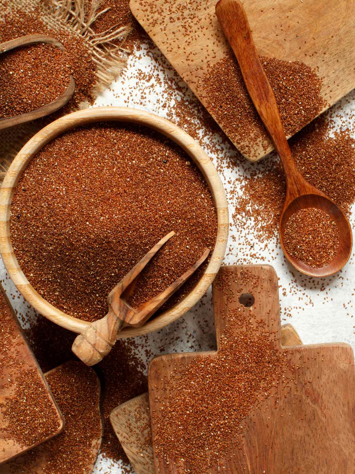 Teff grains placed in wooden bowl and spoon